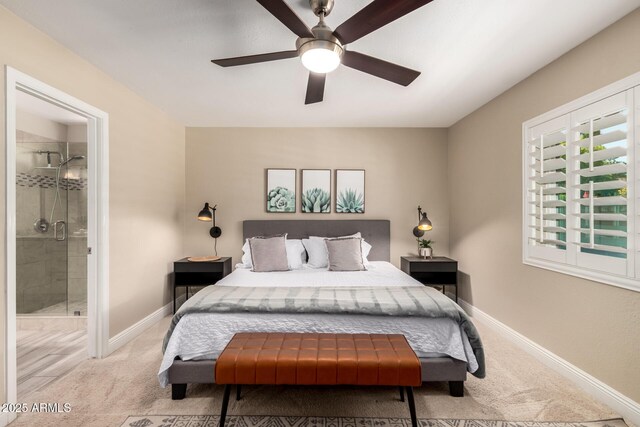 4316 E Janice Way, Phoenix, AZ 85032 - carpeted bedroom with connected bathroom, baseboards, and ceiling fan