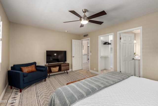 4316 E Janice Way, Phoenix, AZ 85032 - carpeted bedroom with baseboards, a ceiling fan, and a walk in closet