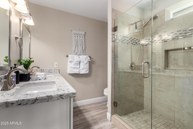 4316 E Janice Way, Phoenix, AZ 85032 - bathroom featuring a shower stall, baseboards, double vanity, and toilet