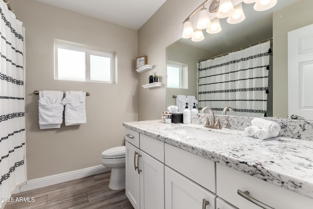 4316 E Janice Way, Phoenix, AZ 85032 - full bath featuring toilet, wood finished floors, vanity, baseboards, and a chandelier