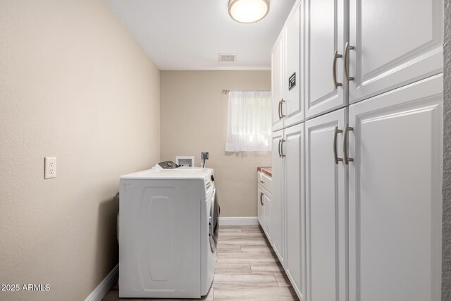 4316 E Janice Way, Phoenix, AZ 85032 - clothes washing area featuring cabinet space, washing machine and clothes dryer, baseboards, and light wood-style floors
