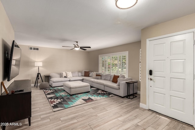 4316 E Janice Way, Phoenix, AZ 85032 - living room with ceiling fan, light wood-style flooring, and baseboards