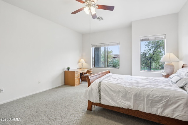 bedroom with light carpet, visible vents, ceiling fan, and baseboards