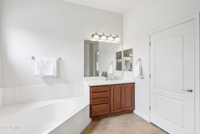 full bathroom with vanity, tile patterned floors, and a bath