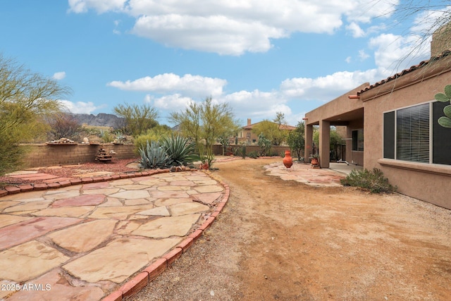 view of yard featuring a patio and fence