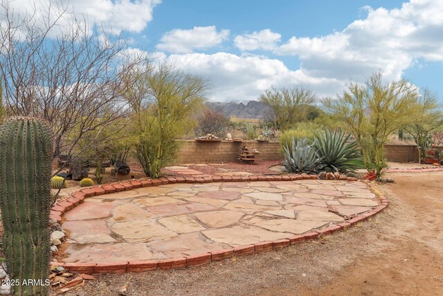 view of patio / terrace featuring fence