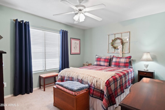 bedroom featuring ceiling fan and light carpet