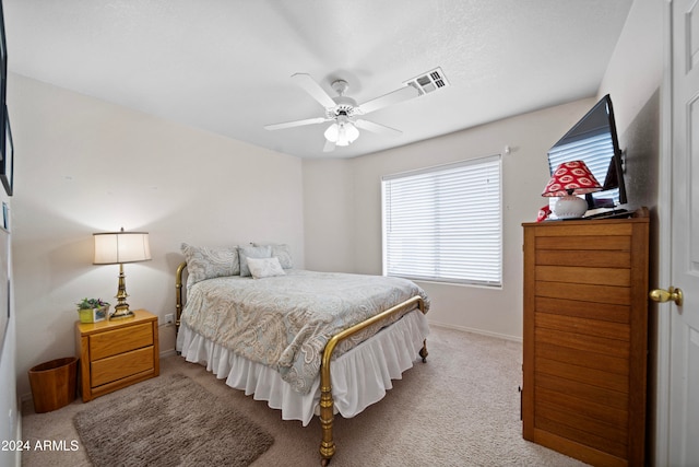 bedroom featuring ceiling fan and light colored carpet