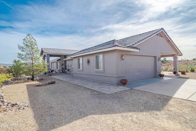 view of side of property with a garage