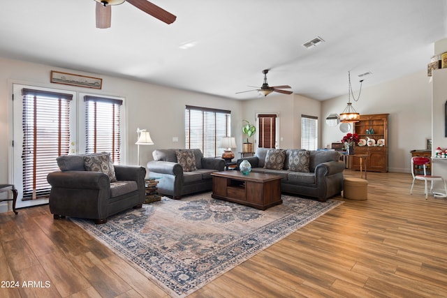 living room with hardwood / wood-style floors and ceiling fan