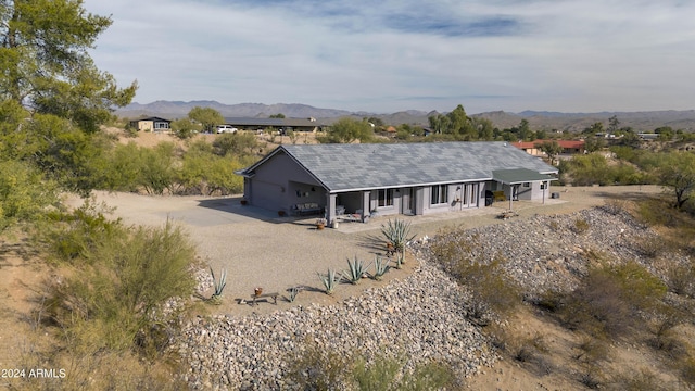 360 Bonita Dr, Wickenburg, AZ 85390 - back of house with covered porch, a mountain view, and driveway