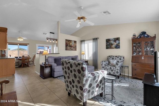 tiled living room featuring vaulted ceiling and ceiling fan