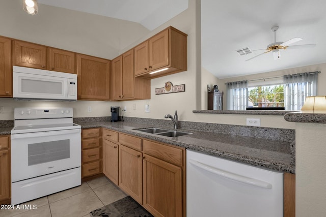 kitchen with lofted ceiling, ceiling fan, sink, white appliances, and light tile patterned floors