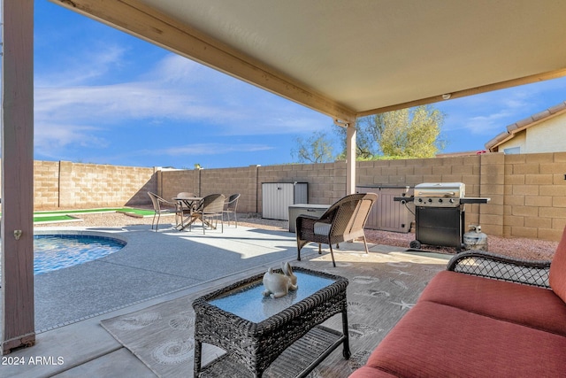 view of patio featuring a grill