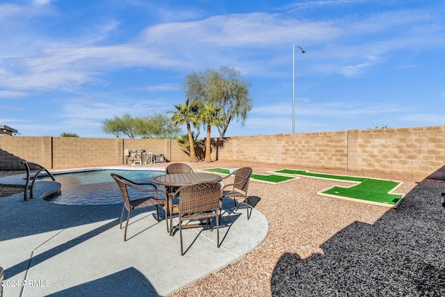 view of patio with a fenced in pool