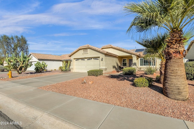 single story home featuring a garage