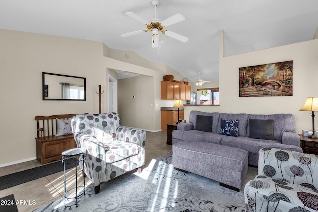 living room featuring ceiling fan, light tile patterned floors, and lofted ceiling