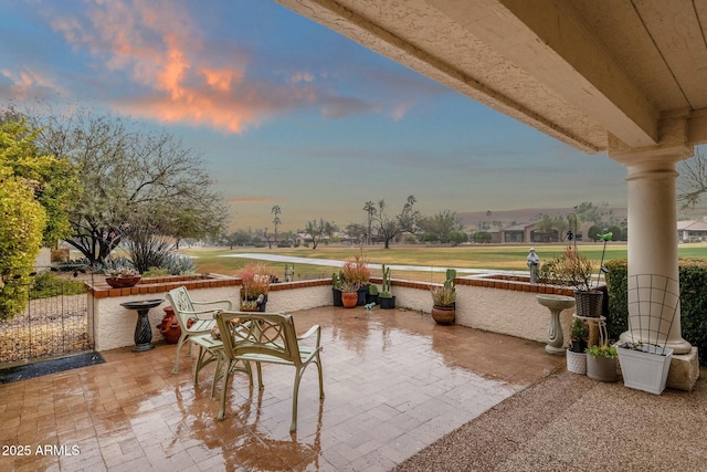 view of patio terrace at dusk