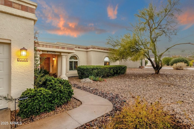 exterior space featuring stucco siding