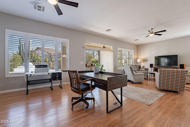 office space with ceiling fan and wood-type flooring