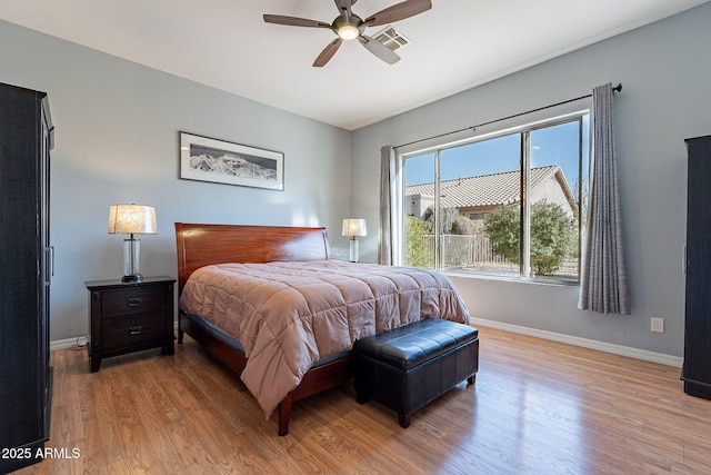 bedroom with ceiling fan and light wood-type flooring