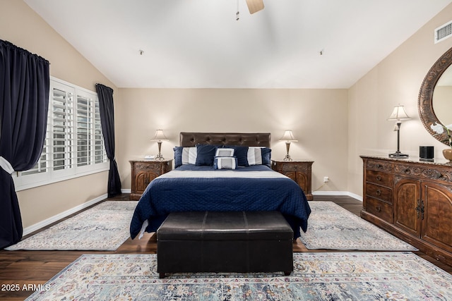 bedroom with lofted ceiling, visible vents, a ceiling fan, wood finished floors, and baseboards