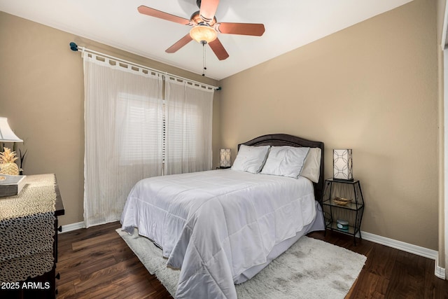 bedroom featuring ceiling fan, wood finished floors, and baseboards