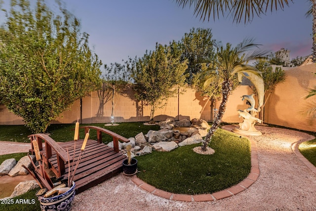 view of yard with a fenced backyard