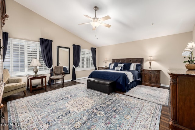 bedroom with vaulted ceiling, wood finished floors, a ceiling fan, and baseboards