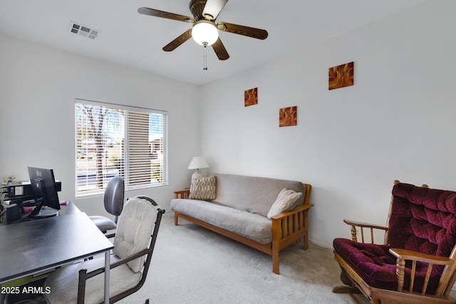 office area featuring light colored carpet and ceiling fan