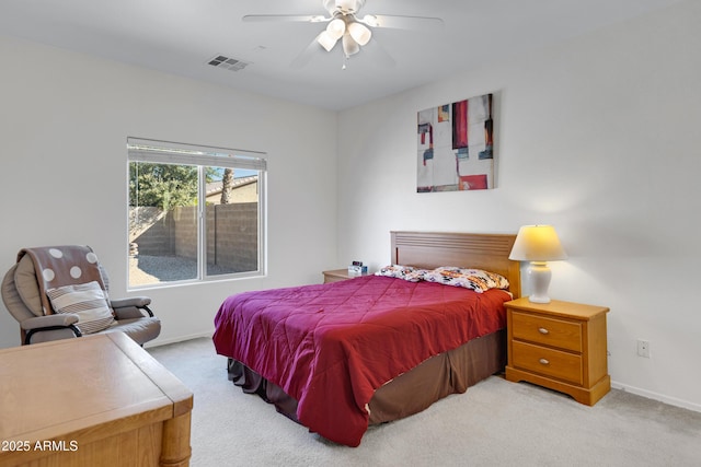 bedroom with light carpet and ceiling fan