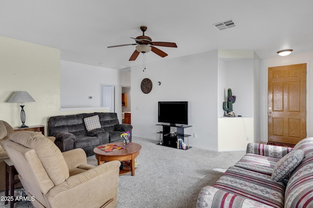 living room featuring ceiling fan and carpet flooring