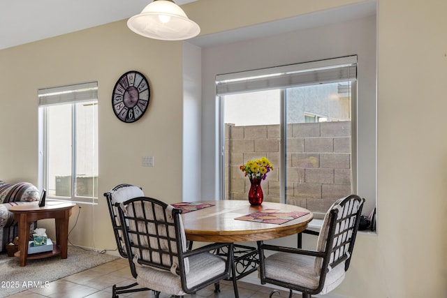 dining space with light tile patterned floors