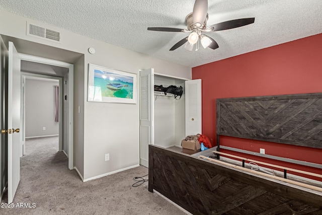 7126 N 19th Ave Unit 152, Phoenix, AZ 85021 - bedroom featuring a textured ceiling, carpet flooring, a closet, and a ceiling fan
