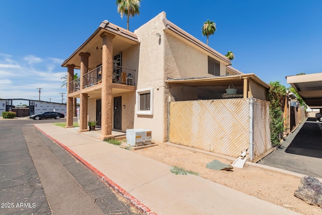 7126 N 19th Ave Unit 152, Phoenix, AZ 85021 - view of front of house with a balcony and stucco siding