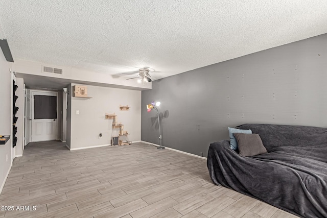 7126 N 19th Ave Unit 152, Phoenix, AZ 85021 - living area with ceiling fan, a textured ceiling, and light wood finished floors