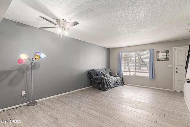 7126 N 19th Ave Unit 152, Phoenix, AZ 85021 - unfurnished room featuring a textured ceiling, a ceiling fan, and light wood-style floors