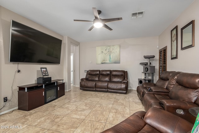 tiled living room with ceiling fan