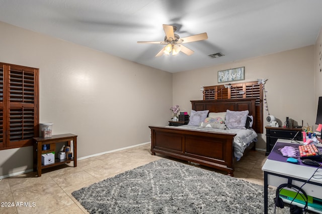 tiled bedroom with ceiling fan