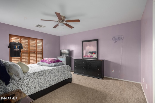 bedroom with ceiling fan and carpet