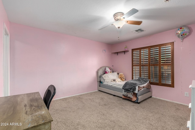 bedroom with ceiling fan and light carpet