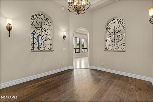 interior space featuring an inviting chandelier and wood-type flooring