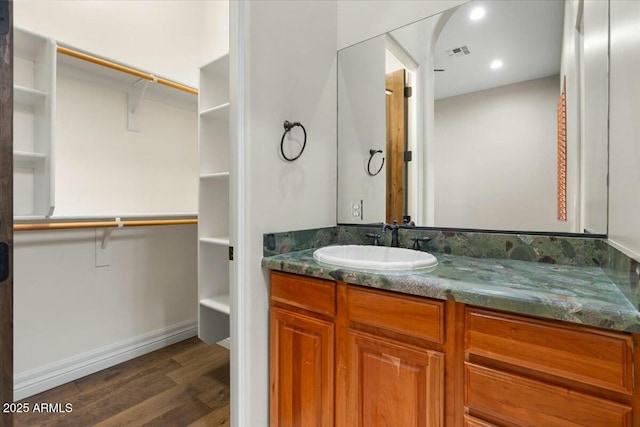 bathroom with vanity and hardwood / wood-style floors