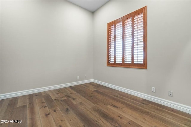 empty room featuring hardwood / wood-style floors