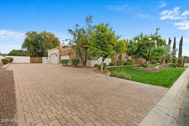 view of front of home with a garage and a front yard