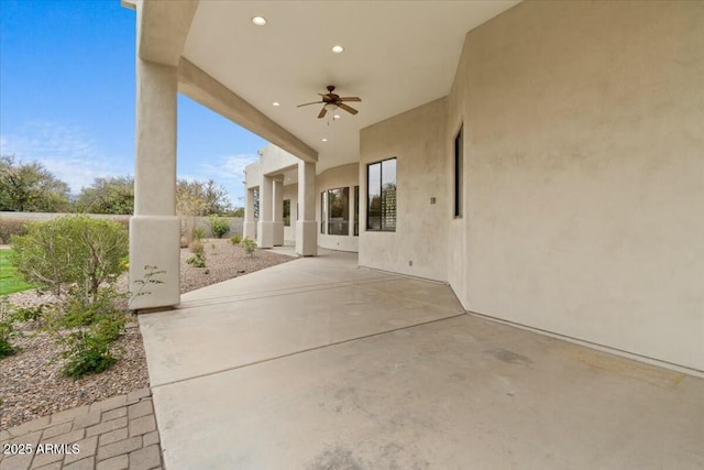 view of patio featuring ceiling fan