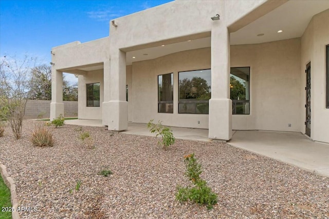 back of house with a patio area