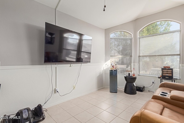 tiled living room with lofted ceiling