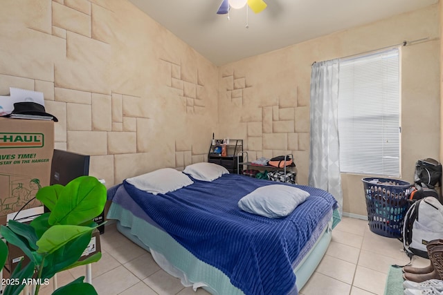 bedroom featuring light tile patterned floors and ceiling fan