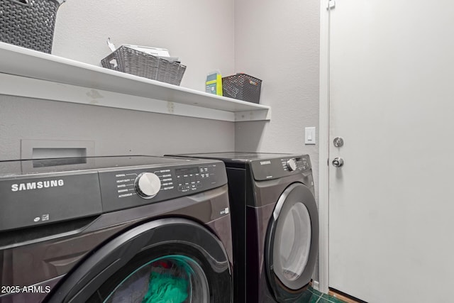 clothes washing area with independent washer and dryer